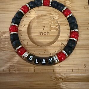 “Slay” bracelet, black onyx and red crackle beads